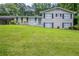 Charming two-story brick home with a well-maintained lawn and covered parking at 3030 Golden Dr, Atlanta, GA 30344