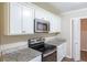 Modern kitchen featuring stainless steel appliances and granite countertops at 3030 Golden Dr, Atlanta, GA 30344