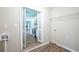 Functional laundry room with view of kitchen and wood floors, providing convenience and style at 3030 Golden Dr, Atlanta, GA 30344