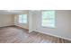 Living room featuring wood floors, large windows, and neutral paint at 3030 Golden Dr, Atlanta, GA 30344