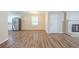 Open floor plan showcasing newly installed vinyl flooring and access to the kitchen at 3030 Golden Dr, Atlanta, GA 30344