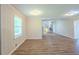 Living room featuring wood floors, large windows, and fresh paint at 3030 Golden Dr, Atlanta, GA 30344