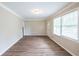 Bright living room featuring wood floors, large windows, and fresh paint at 3030 Golden Dr, Atlanta, GA 30344