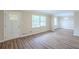 Bright living room featuring wood floors, a window, and fresh paint at 3030 Golden Dr, Atlanta, GA 30344