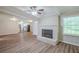 Open floor plan showing brick fireplace, new vinyl floors, and connection to kitchen at 3030 Golden Dr, Atlanta, GA 30344