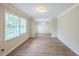 Bright living room featuring wood floors, large windows, and neutral paint at 3030 Golden Dr, Atlanta, GA 30344