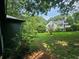Lush backyard with trees and greenery, offering a private outdoor space for relaxation and recreation at 1497 Elizabeth Ln, East Point, GA 30344