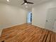 This bedroom includes hardwood floors, a ceiling fan, two doors, and ample light at 1497 Elizabeth Ln, East Point, GA 30344