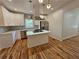 Modern kitchen with an island cooktop, stainless steel appliances, and white cabinets at 1497 Elizabeth Ln, East Point, GA 30344