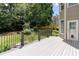 The deck overlooks a professionally landscaped, fenced backyard with lush green grass at 2625 Morningside Nw Trl, Kennesaw, GA 30144