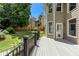 Wooden deck with black metal railing provides backyard views and outdoor entertaining space at 2625 Morningside Nw Trl, Kennesaw, GA 30144