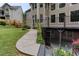 A large backyard features a covered deck and walkway with lush landscaping at 2625 Morningside Nw Trl, Kennesaw, GA 30144