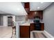 Basement kitchenette with granite counters, updated appliances, and bar seating at 2625 Morningside Nw Trl, Kennesaw, GA 30144