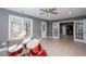 A bonus room with a ceiling fan and tile floors includes double doors and windows at 2625 Morningside Nw Trl, Kennesaw, GA 30144