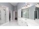 Bathroom featuring dual sinks, a vanity, white cabinets, and a glass-enclosed shower at 2625 Morningside Nw Trl, Kennesaw, GA 30144