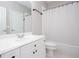 Clean bathroom features a white vanity, toilet, and shower with a tub at 2625 Morningside Nw Trl, Kennesaw, GA 30144