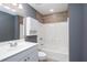 Well-lit bathroom featuring a shower-tub combination and vanity with storage at 2625 Morningside Nw Trl, Kennesaw, GA 30144