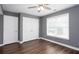Bedroom featuring a ceiling fan, a window, and a closet at 2625 Morningside Nw Trl, Kennesaw, GA 30144