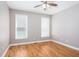 Cozy bedroom with hardwood floors, neutral walls, and a ceiling fan at 2625 Morningside Nw Trl, Kennesaw, GA 30144