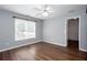 A bright bedroom features wood-look floors, pale blue walls, white trim, and a large window at 2625 Morningside Nw Trl, Kennesaw, GA 30144