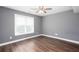 Bedroom featuring a ceiling fan, neutral paint, and wood-look floors at 2625 Morningside Nw Trl, Kennesaw, GA 30144