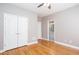 Bedroom with hardwood floors, closet, and ensuite bathroom at 2625 Morningside Nw Trl, Kennesaw, GA 30144