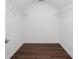 Walk-in closet featuring wood-look floors and white walls and shelves at 2625 Morningside Nw Trl, Kennesaw, GA 30144