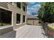 Back deck view of property, windows, and back yard features landscaping at 2625 Morningside Nw Trl, Kennesaw, GA 30144