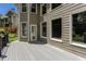 Well-maintained deck features durable composite material, neutral color and a pet door for easy backyard access at 2625 Morningside Nw Trl, Kennesaw, GA 30144