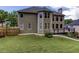 A large backyard features mature trees and well-maintained lawn at 2625 Morningside Nw Trl, Kennesaw, GA 30144