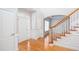 Inviting foyer with gleaming hardwood floors, staircase and white trim and an open design at 2625 Morningside Nw Trl, Kennesaw, GA 30144