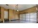 Spacious garage with epoxy floor and storage shelves, ready for your vehicles and projects at 2625 Morningside Nw Trl, Kennesaw, GA 30144