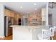 Open kitchen with stainless steel appliances, granite countertops, and breakfast bar at 2625 Morningside Nw Trl, Kennesaw, GA 30144