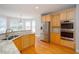 Charming kitchen with stainless steel appliances and generous counter space at 2625 Morningside Nw Trl, Kennesaw, GA 30144