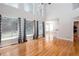Bright living room boasts hardwood floors, large windows, and an open floor plan at 2625 Morningside Nw Trl, Kennesaw, GA 30144