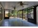 Enclosed screened porch with ceiling fans offers transition from indoors to the garden at 2625 Morningside Nw Trl, Kennesaw, GA 30144