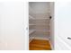Walk-in closet with ample shelving and hardwood floors at 2625 Morningside Nw Trl, Kennesaw, GA 30144