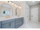 Bright bathroom with a double vanity, white countertop, and matching gold fixtures and hardware at 419 Crestmont Ln, Canton, GA 30114