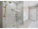 Spa-like bathroom featuring glass shower, soaking tub, and double vanity at 419 Crestmont Ln, Canton, GA 30114