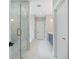 Bright bathroom featuring a glass shower, soaker tub, and white marble tile at 419 Crestmont Ln, Canton, GA 30114