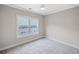 Neutral bedroom featuring plush carpeting, and a bright window view at 419 Crestmont Ln, Canton, GA 30114