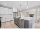 Grey island with white countertops and cabinets, stainless steel appliances, and an open layout at 419 Crestmont Ln, Canton, GA 30114