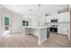 Bright kitchen features an island, modern appliances, and white cabinets and countertops at 419 Crestmont Ln, Canton, GA 30114