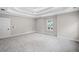 Expansive primary bedroom with trey ceilings and neutral color palette at 419 Crestmont Ln, Canton, GA 30114