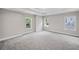 Main bedroom offers neutral palette, plush carpeting, and natural lighting at 419 Crestmont Ln, Canton, GA 30114