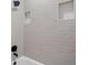 Close-up of a tiled shower with modern fixtures and recessed shelving at 419 Crestmont Ln, Canton, GA 30114