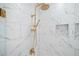 Modern shower features gold fixtures, marble tile, and a rainfall shower head at 419 Crestmont Ln, Canton, GA 30114