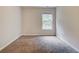 Empty bedroom with carpeted floor, neutral walls, and a window providing natural light at 5025 Bishops Row Row, Austell, GA 30106