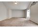 Large bedroom with carpeted floor, vaulted ceiling, and a window dressed with white curtains at 5025 Bishops Row Row, Austell, GA 30106