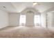Large bedroom with vaulted ceilings, carpet flooring, and windows with sheer curtains at 5025 Bishops Row Row, Austell, GA 30106